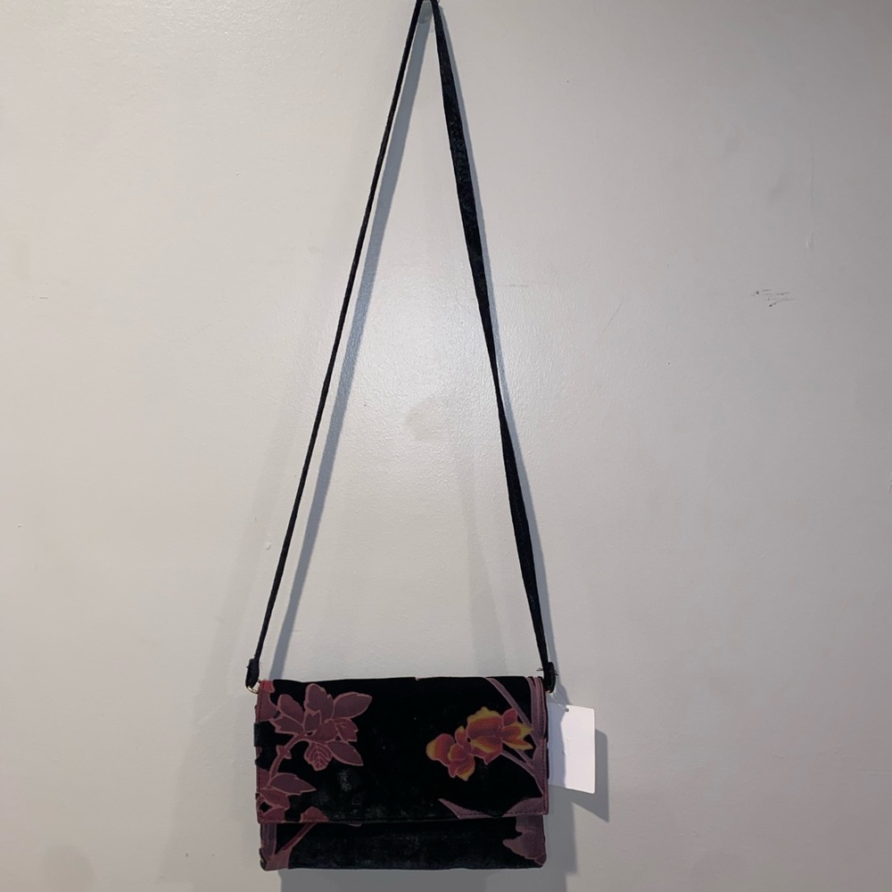Crushed velvet purse with removable strap.